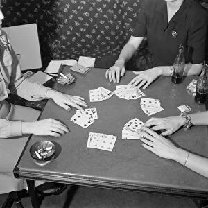CARD GAME, 1941. Women playing cards and drinking Coca-Cola in Detroit, Michigan