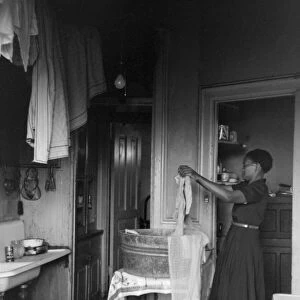 CHICAGO: APARTMENT, 1941. A woman in her apartment on the South Side of Chicago, Illinois