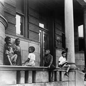 CHICAGO: CHILDREN, 1941. Children in front of apartment buildings on the South Side of Chicago