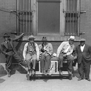 CHICAGO: MEN, 1941. Men pose for a photograph on the street in Chicago, Illinois