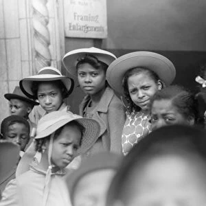 CHICAGO: MOVIE THEATER. Children lined up to see the Easter Sunday matinee at a