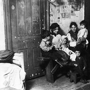 CHICAGO: TENEMENT, 1910. Italian immigrant family in a tenement home, Chicago, Illinois