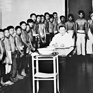 Chinese boys awaiting medical examinations at Angel Island immigration station in San Francisco Bay, c1910