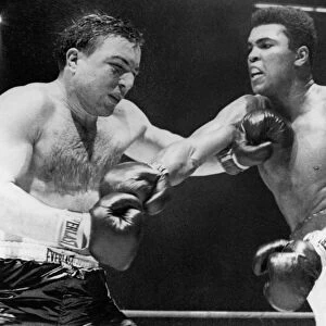 CHUVALO AND ALI, 1966. Canadian boxer George Chuvalo and American boxer Muhammad Ali (nÔÇÜ Cassius Clay) during the 14th round of a fight in Toronto, March 1966