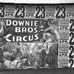 CIRCUS ADVERTISEMENT, 1936. Billboard posters covering the side of a building advertising the Downie Brothers three ring circus near Lynchburg, South Carolina. Photograph by Walker Evans, 1936