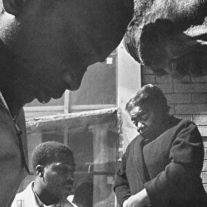 Two civil rights activists help an African American couple from Mississippi register to vote during the Freedom Summer of 1964
