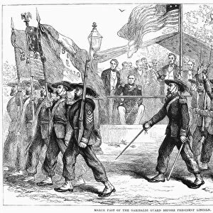 CIVIL WAR: 39th REGIMENT. The 39th New York State Volunteers, known as the Garibaldi Guard, carrying the Italian revolutionary tricolor flag, marching past President Lincoln during the Civil War, c1862. Wood engraving, late 19th century