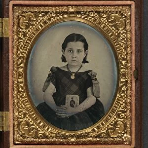 CIVIL WAR: MOURNING, c1865. Portrait of a girl wearing a mourning dress, holding