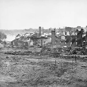 CIVIL WAR: RICHMOND, 1865. Guns and ruins near the Tredegar Iron Works at Richmond, Virginia following the American Civil War. Photograph, April 1865