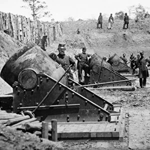 CIVIL WAR: UNION MORTARS. 13 inch seacoast mortars of the Federal Battery Number 4, with officers of the Connecticut Heavy Artillery, near Yorktown, Virginia. Photograph by James F. Gibson, May 1862