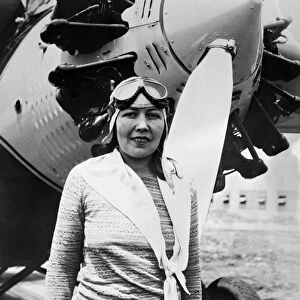 CLAIRE FAHY (1899?-1930). American aviator. Fahy photographed in front of her airplane