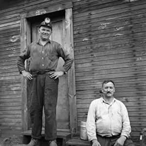 COAL MINERS, 1938. Two coal miners at Scotts Run, West Virginia