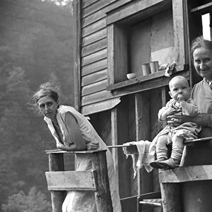 COAL MINERs FAMILY, 1938. Mother, wife and baby of unemployed coal miner, Marine, West Virginia