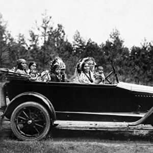 COEUR D ALENE, c1916. Coeur D Alene family of Phillip Wildshoe, in his Chalmers automobile. Photographed c1916
