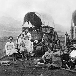 COLORADO: HOMESTEADERS. A family of homesteaders and their wagons in Colorado. Photograph