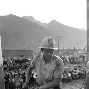 COLORADO: MINER, 1940. A gold miner participating in a drilling contest on Labor Day in Silverton