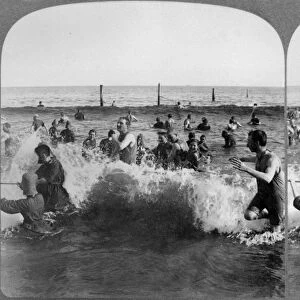 CONEY ISLAND: BEACH, c1903. Bathers in the breaking waves at Coney Island, Brooklyn, New York