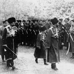 COSSACK INSPECTION. Russian Czar Nicholas II and his son Alexei inspect Cossack troops