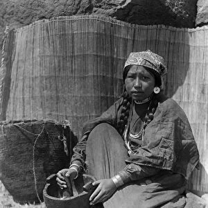 CURTIS: WISHRAM WOMAN. A Wishram Native American woman in Washington State with a mortar