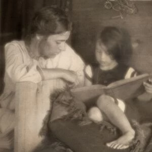 DAY: MOTHER AND CHILD, c1909. Beatrice Baxter Ruyl reading to her daughter Ruth