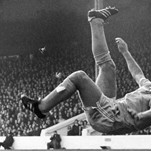 DENIS TUEART (1949- ). English soccer player. Tueart playing for Manchester City trying an overhead scissor kick to score against the Queens Park Rangers, 16 October 1976
