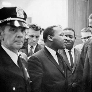 Dr. Martin Luther King Jr. (left), American cleric and civil rights leader, photographed with American religious and political leader Malcolm X, before a press conference in Washington, D. C. 26 March 1964