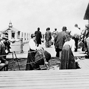 ELLIS ISLAND, c1915. Immigrants arriving at Ellis Island in New York Harbor. Photograph