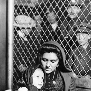 ELLIS ISLAND: IMMIGRANTS, 1905. An Italian mother and child; photographed by Lewis W
