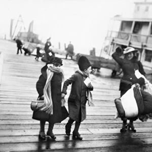 ELLIS ISLAND: IMMIGRANTS. A family of Belgian refugees arriving at Ellis Island, New York City