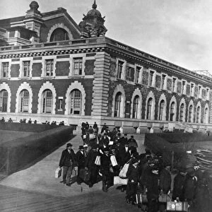 ELLIS ISLAND: IMMIGRANTS. Immigrants wainting for a boat after having passed inspection