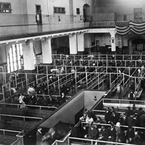ELLIS ISLAND: IMMIGRANTS. Immigrants waiting to be processed in the reception hall at Ellis Island