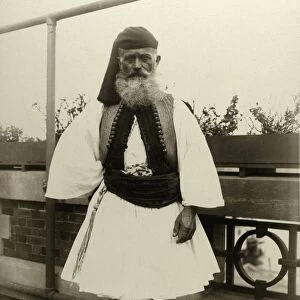 ELLIS ISLAND: MAN, 1909. Portrait of a Greek man wearing the evzone uniform at Ellis Island