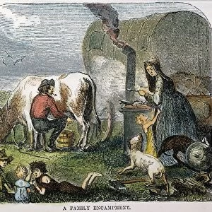 EMIGRANTS TO THE WEST. An emigrant family encamped for the night on the great American prairie. Engraving, 19th century