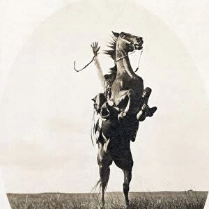 ERWIN E. SMITH (1886-1947). American cowboy photographer. Photographed riding a bucking bronco on the open range of Texas on 14 December 1908