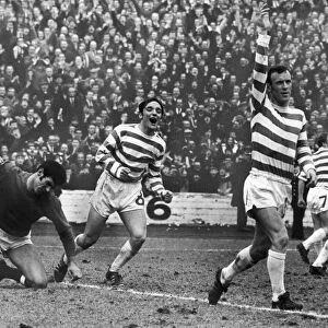 EUROPEAN CUP, 1970. Lou Macari (center) and Bobby Lennox of Celtic FC rejoice after scoring the winning goal against Dundee United to go to the European Cup Final, 1970, to the dismay of Ally Donaldson, the Dundee goalkeeper