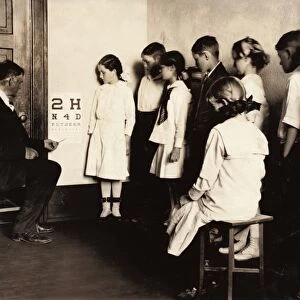 EYE EXAM, 1917. School children receiving eye exams at Washington School in Lawton, Oklahoma