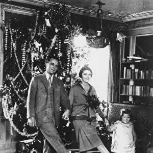 F. SCOTT FITZGERALD FAMILY Francis Scott Key Fitzgerald (1896-1940). American writer. At Christmas-time with his wife Zelda and daughter Scottie