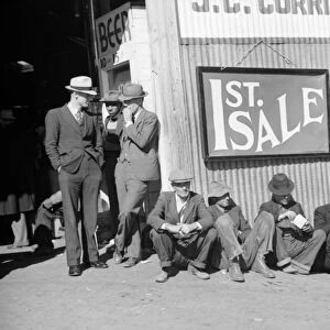 FARM AUCTION, 1939. Farmers drinking beer and eating ice cream while waiting for