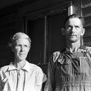 FARM COUPLE, 1938. Sharecropper and wife near Carutherville, Missouri. Photograph by Russell Lee