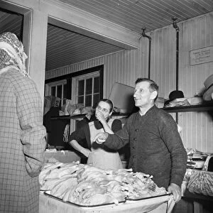 FARMERS MARKET, 1942. Mennonite farmer and wife selling fowl at a farmers market in Lititz