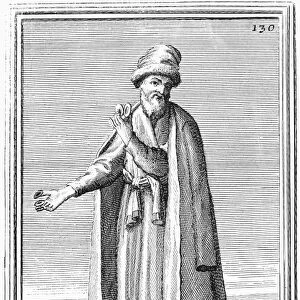 FINGER CYMBALS, 1723. A Coptic priest with finger cymbals used to accompany the chanting of prayers. Copper engraving, 1723, by Arnold van Westerhout