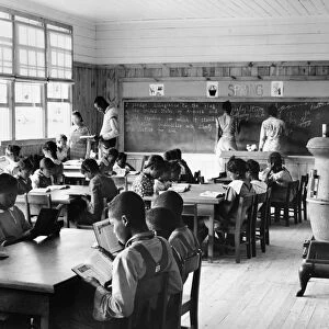 A first grade classroom in Gees Bend, Alabama, showing the extreme ages of the students. Photograph by Marion Post Wolcott, 1939