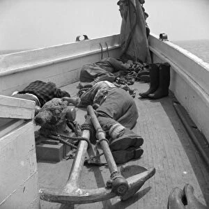FISHERMEN, 1943. Fishermen sleeping on the deck of the fishing boat Alden out of Gloucester