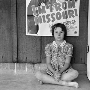 FLOOD REFUGEE, 1939. A young flood refugee from Missouri in Westley, California
