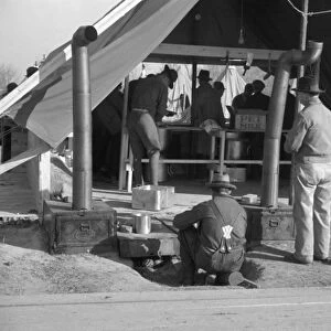 FLOOD REFUGEES, 1937. The kitchen tent at a flood refugee camp in Forrest City, Arkansas