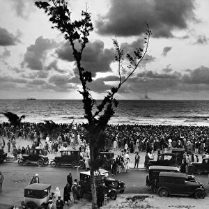 FLORIDA: MIAMI BEACH, 1927. People gather at sunrise at Miami Beach, Florida, 1927. Photograph likely taken on 17 April 1927, when thousands of people assembled on Easter Sunday to pray for recovery from the Great Miami Hurricane that hit the city in September 1926