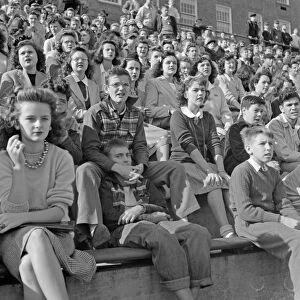FOOTBALL GAME, 1943. Spectators at a football game at Woodrow Wilson High School in Washington D