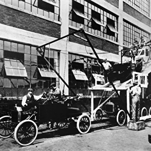 FORD ASSEMBLY LINE, 1913. The last stage of the Model T assembly line at the Ford