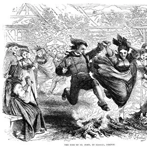 FRANCE: ST. JOHNs DAY, 1867. Villagers dancing around bonfires in Alsatia, France