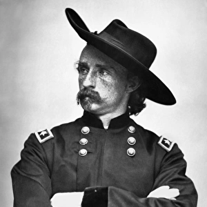 GEORGE CUSTER (1839-1876). American army officer. Photographed during the Civil War in the uniform of a Union Army major general